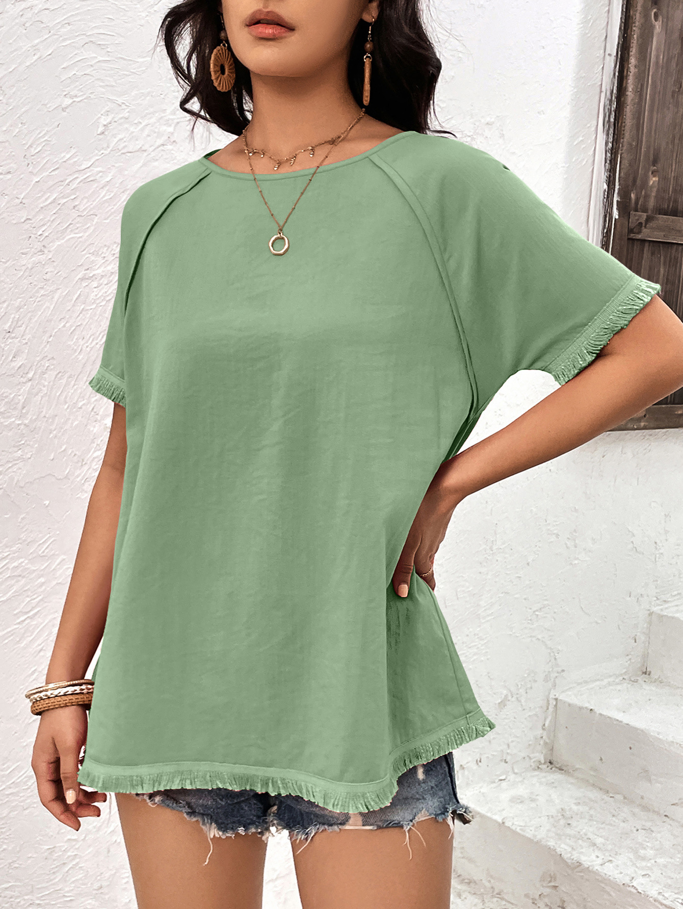 Top casual ampio con scollo tondo e frange da donna_voghion.com