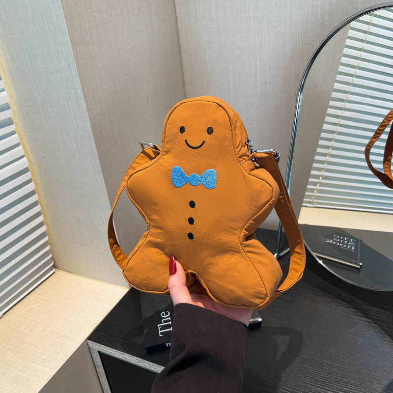 Bolso pequeño de hombre de pan de jengibre de Navidad 2025 verano nuevo bolso femenino diseño de nicho bolso de hombro lindo bolso de lona