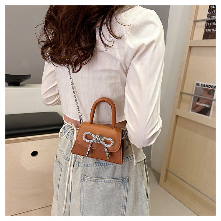 Ins niche French textured bag female 2024 new bow small square bag stylish shoulder messenger bag_voghion.com
