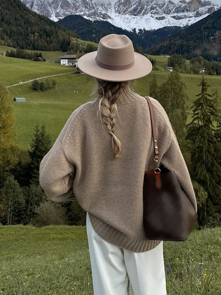 Simple estilo de alta sensación suelta de cuello alto color sólido suéter de manga larga para mujeres 2025 otoño y invierno nuevo estilo transfronterizo europeo y americano