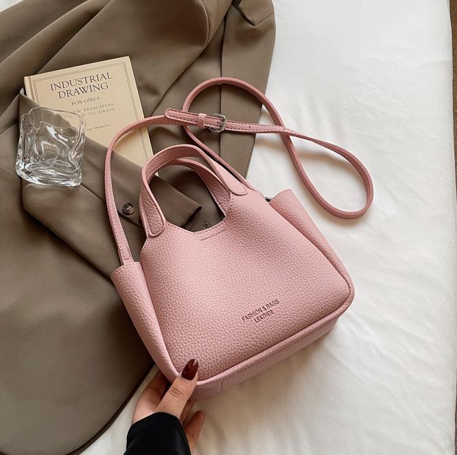 Bolso de cubo de mano transfronterizo sentido de alta gama para mujer 2025 nuevo bolso de mensajero de un solo hombro simple y versátil bolso de canasta de verduras de nicho