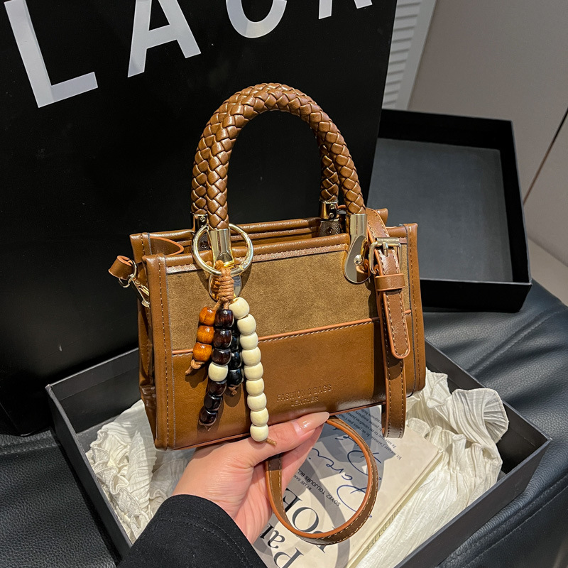 Niche Zhong Leopard Pattern retro bolso de mano mujer otoño / invierno 2025 nuevo estilo de alta calidad de viaje de hombro mochila