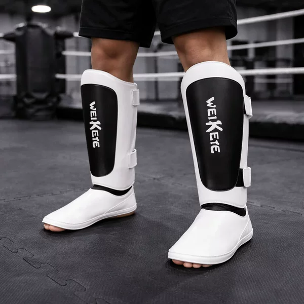 Factory Direct Sale Boxing Leg Guards, Ultra-Fiber Leather Muay Thai Sanda Fighting Professional Leg Guards, Ankle Guards, and Shin Guards