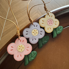 本革のマカロンの頭の層は日焼けした牛革の霧のワックスの皮の花のキーホルダーを植えて包みます。