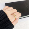 Fashionable gemstone ring stainless steel, jewelry, zirconium, simple and elegant design, 750 sample gold, golden color, on index finger