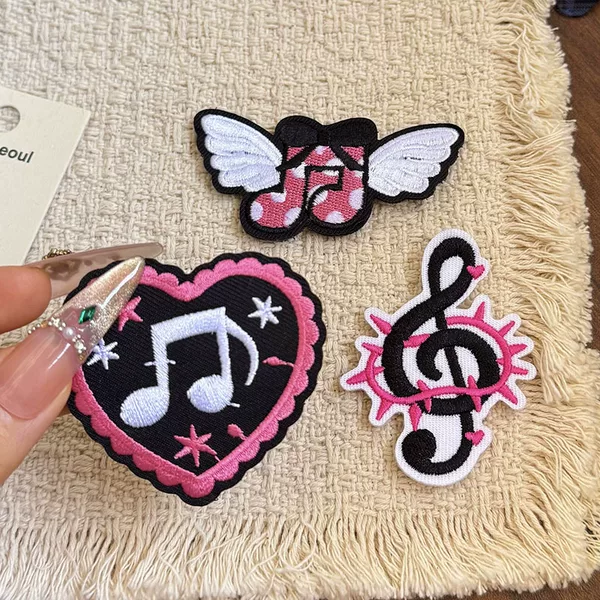 Black, spicy, and trendy Y2K-style clothing, accessories, and bags featuring musical notes, sweet and cool designs, hearts, skulls, butterflies, embroidery, and Velcro closures for women