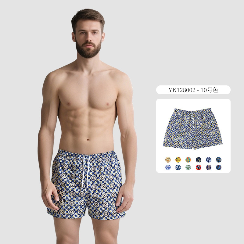 Pantalones de cuatro puntos florales de piel de melocotón para hombre, bañador casual de playa de tamaño europeo, forro de secado rápido, pantalones de playa de vacaciones junto al mar