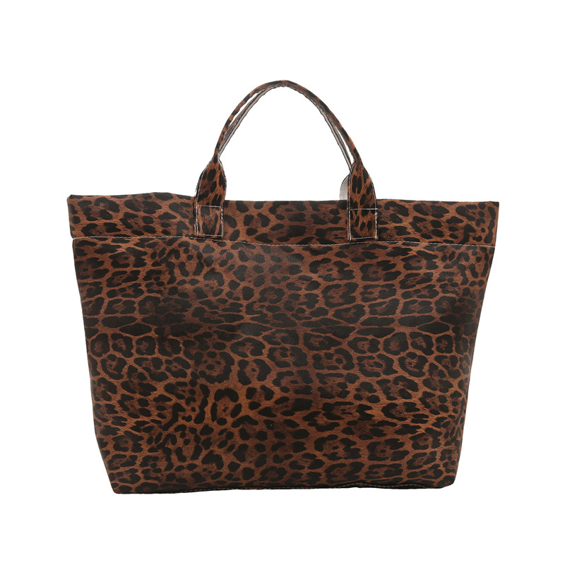 Europa y los Estados Unidos retro leopardo de gran capacidad 2025 nueva bolsa de mano de viento perezoso simple de moda de viaje elegante bolsa de mano