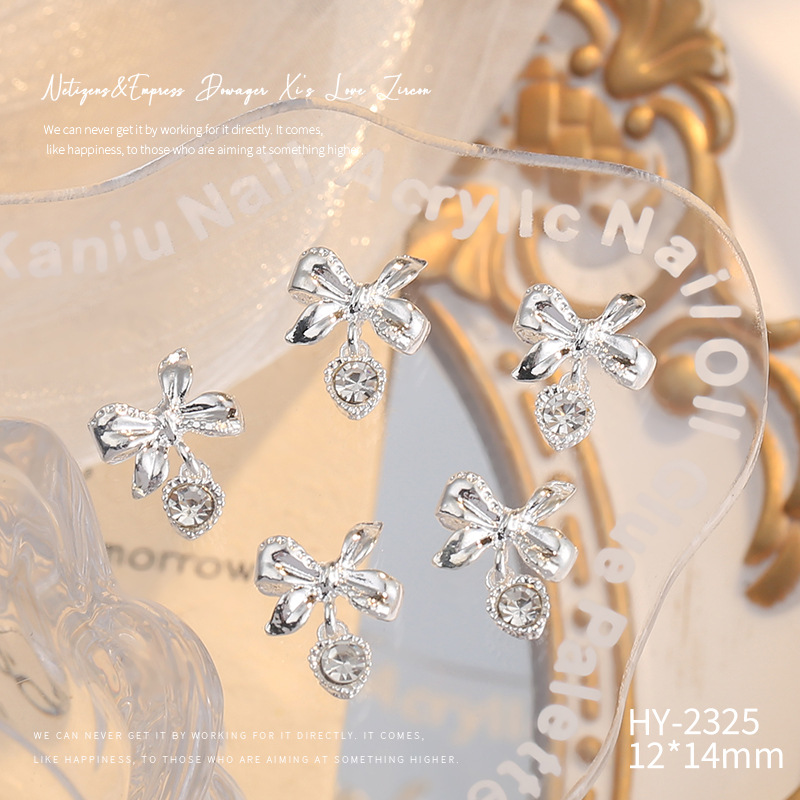 Nueva joyería de aleación de manicura completa diamante borla arco corona plata uñas manicura joyería accesorios al por mayor