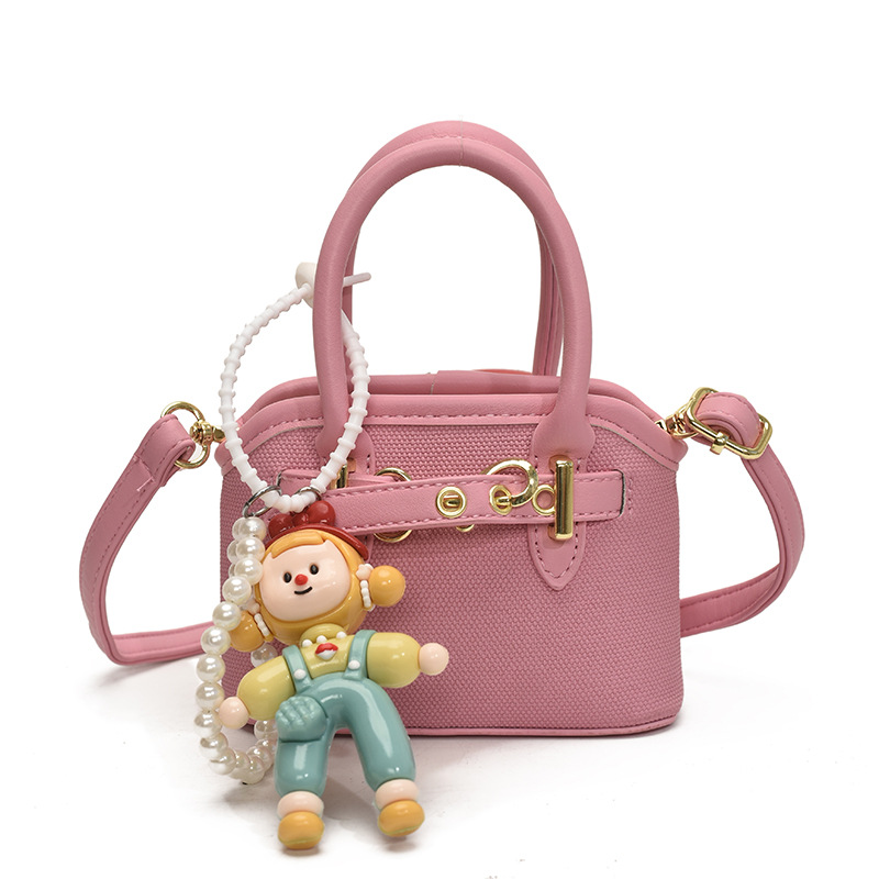 Bolsos de mano para niños lindos colgantes extranjeros mini bolsos de hombro para niños y niñas de color sólido simple bolsos de conchas de niños de moda