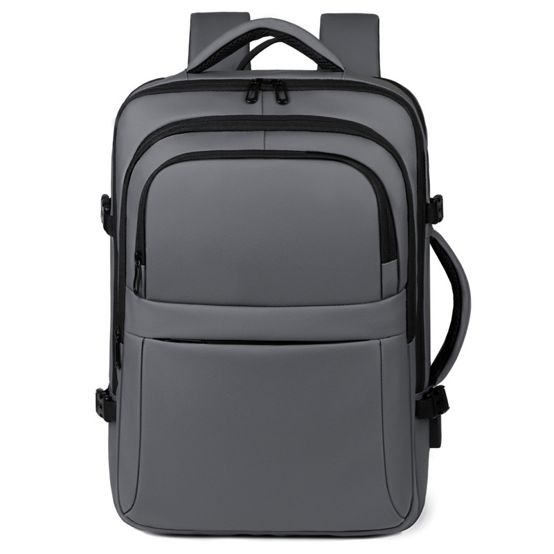 Mochila simple de color sólido de gran capacidad para hombres con capacidad de expansión multi-compartimiento USB colgando varilla de tracción mochila de viaje