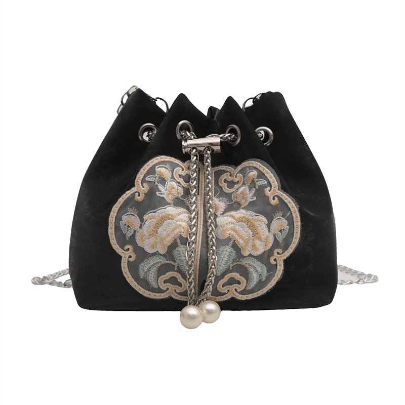 Bolso de diseño de nicho para mujeres 2024 verano nuevo retro mochila de hombro casual simple bolso de cubo casual para mujeres