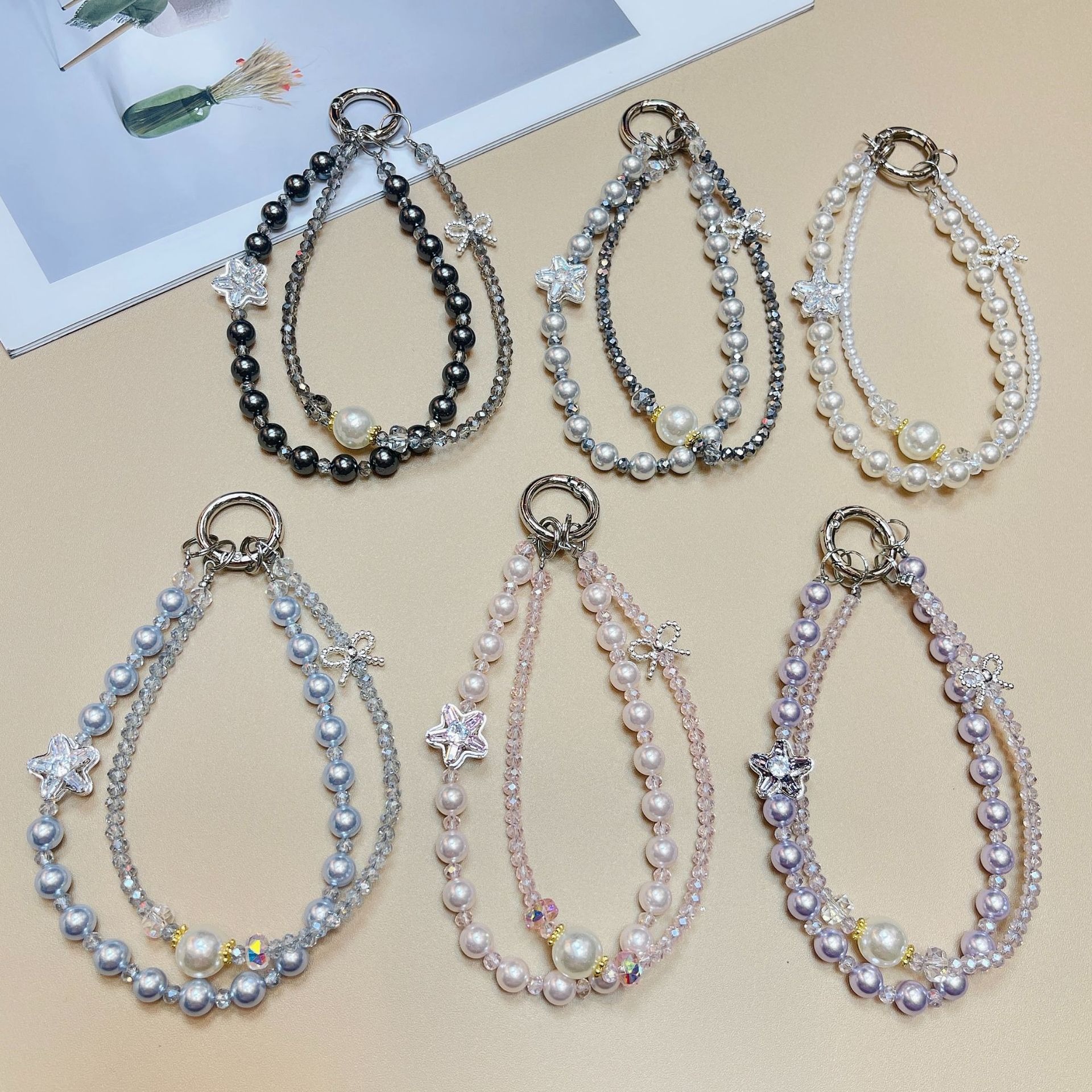 Cordón de teléfono móvil de doble cadena de cristal de moda cordón de muñeca con cuentas de alta gama colgante de estrella llavero de perlas cabello de una pieza