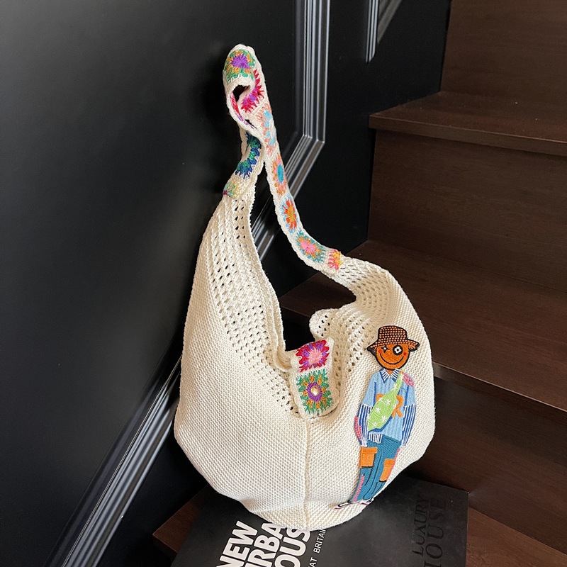 Versión coreana del bolso de nicho 2025 verano nuevo bolso femenino bolso tejido perezoso bolso de hombro casual de gran capacidad