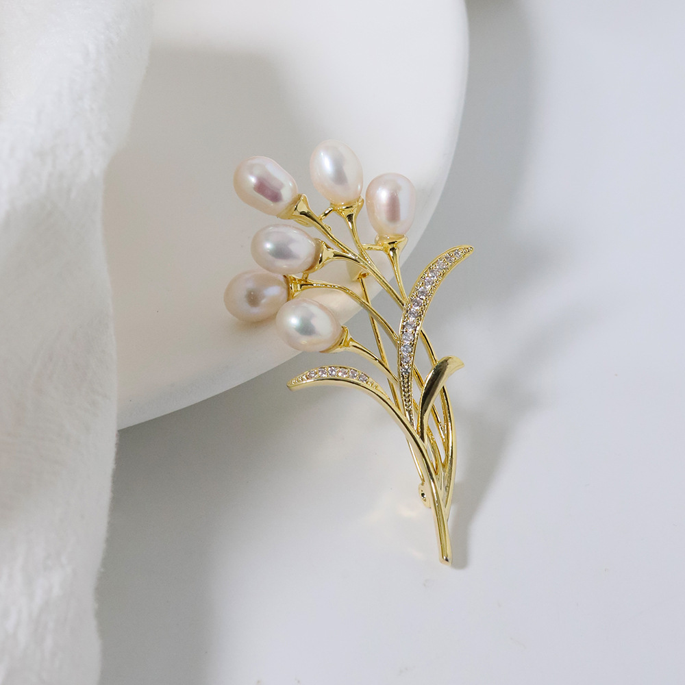 Nuevo globo original broche de perla de trigo de alta calidad nicho de diseño femenino broche coreano ligero de lujo pecho de moda