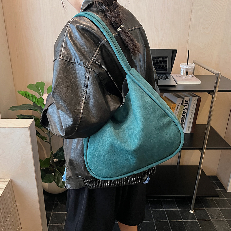 Transfronterizo 2025 otoño y invierno nuevo retro cubo de cuero de seda bolsas de mano para mujeres bolsas de braza simple y versátil bolsas de hombro de viaje
