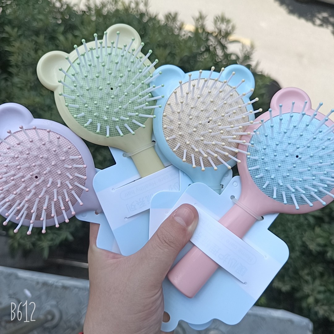 Bonito peine de peinado color macarrón con cojín de aire para masaje, adecuado para uso doméstico y dormitorios estudiantiles, cepillo de pelo de plástico suave con cojín de aire.