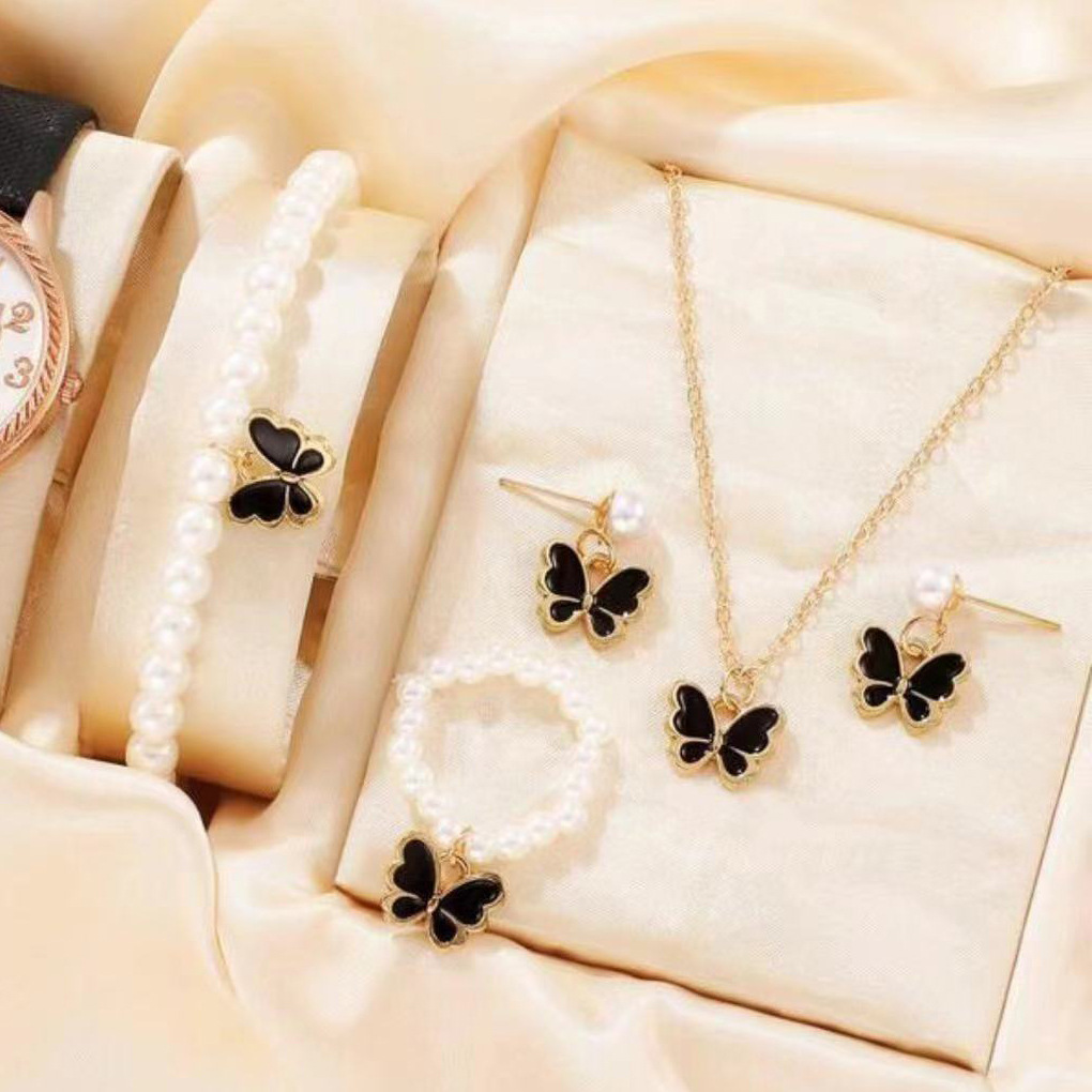 Nuevo traje de joyería para niños populares transfronterizos gota aceite mariposa encanto perla pulsera pendientes collar joyería para mujeres