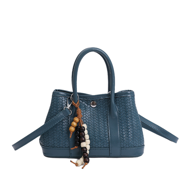 Bolsa de mano de alto nivel transfronterizo trenzada bolsa de cubo de agua para mujeres otoño y invierno 2025 nuevo estilo extranjero bolso de hombro bolso de mochila versátil