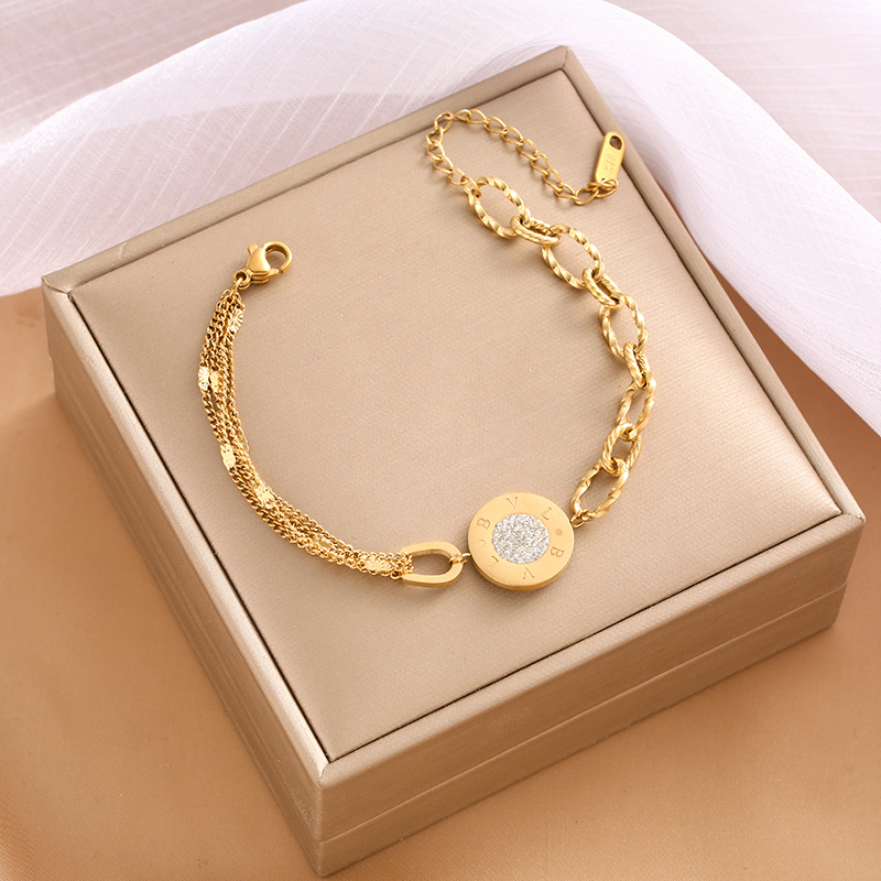 Pulsera de trébol de acero titanium vendedora caliente transfronteriza europea y americana con incrustaciones de concha pulsera colgante pulsera de diseño avanzado sin desvanecimiento al por mayor