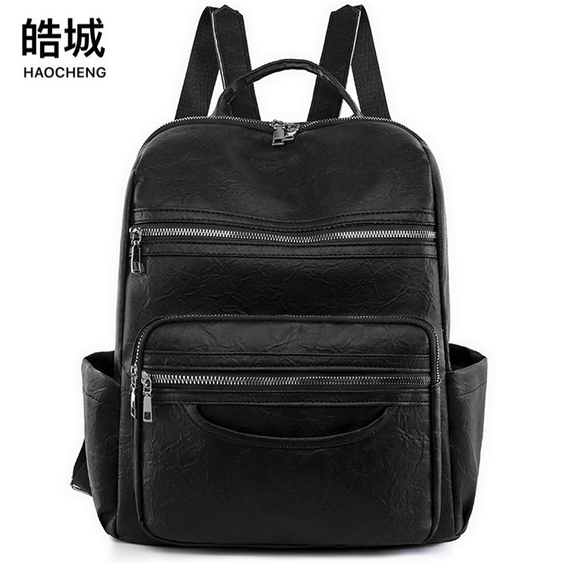 Mochila transfronteriza para mujer 2024 nuevo estilo de cuero suave de gran capacidad mochila de computadora retro de color sólido mochila escolar de moda