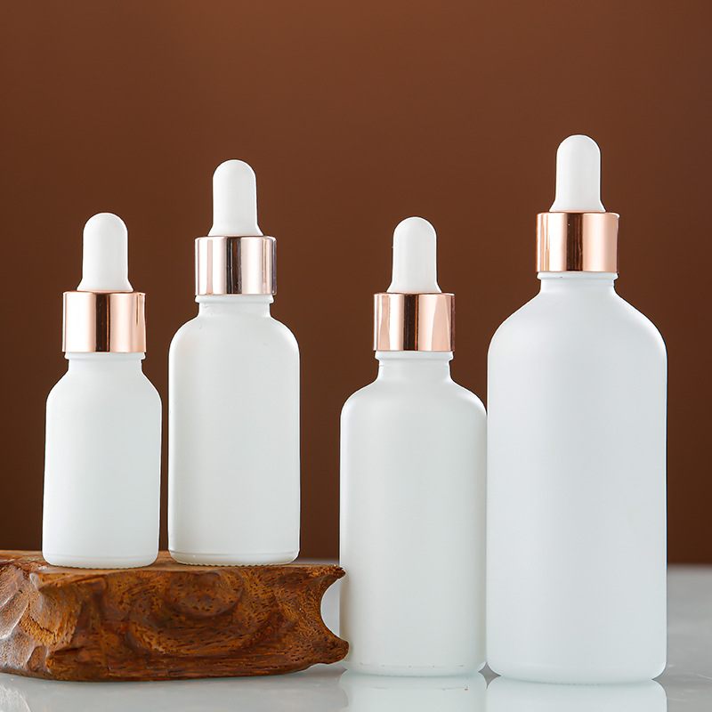 Venta al por mayor aerosol blanco botella de aceite esencial botella cosmética sub-botella 30ml esencia líquida botella redonda botella de plástico cabeza cuentagotas