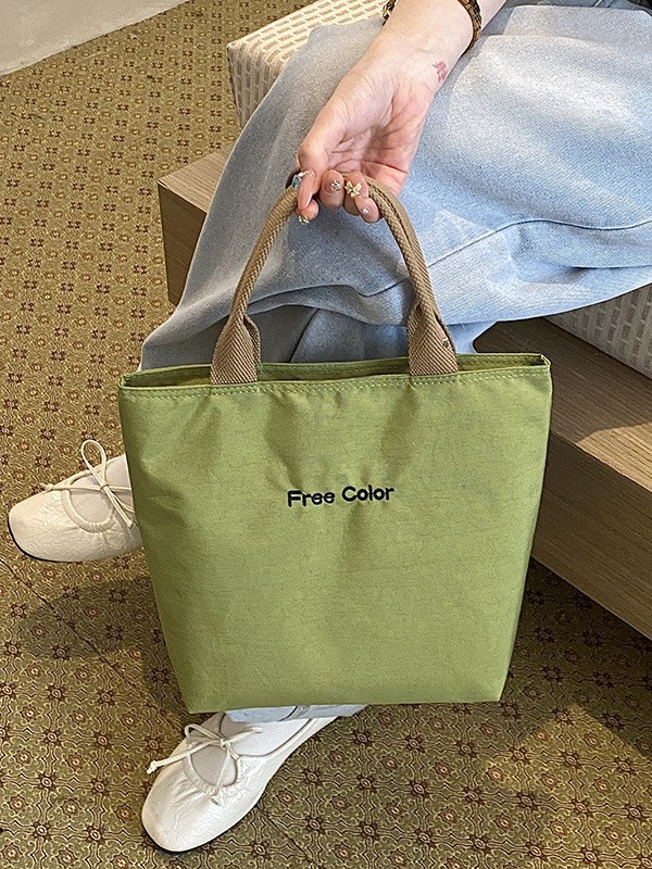 Nicho de diseño nuevo bolso de nylon de color sólido portátil de gran capacidad simple ocio versátil bolso de compras de viaje diario
