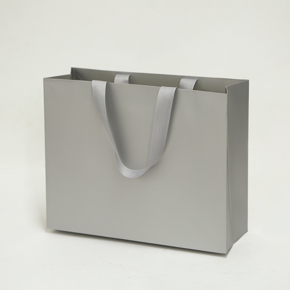 Bolsa de cartón blanco logotipo tienda de ropa bolsa de mano bolsa de regalo espesa bolsa de regalo de Navidad se puede imprimir