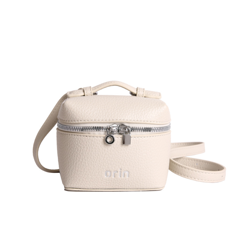 2026 nuevo bolso infantil coreano litchi patrón bolso de caja para hombres y mujeres bolso de cambio de color sólido mini