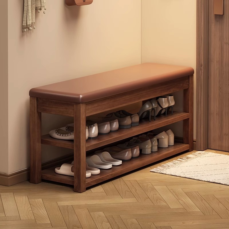 Estante de zapatos de madera maciza puerta doméstica multicapa simple taburete de cambio de zapatos 2026 nuevo tipo explosivo gabinete de zapatos interior
