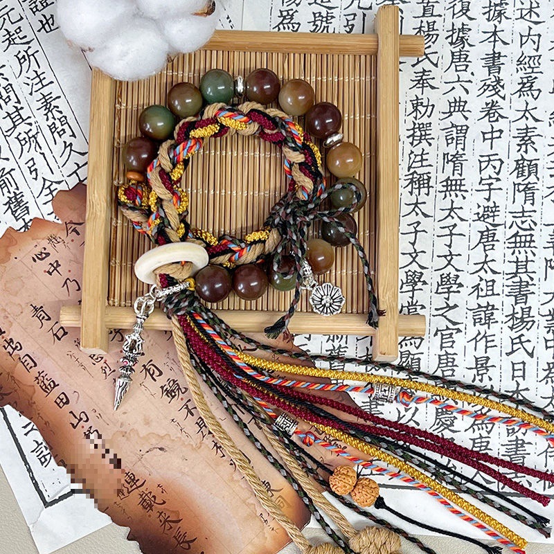 "Gesang" cordón tibetano tejido a mano de raíz de bodígan pequeño libro rojo pulsera nacional tejida productos terminados de venta caliente