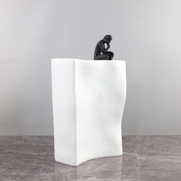 Modern minimalist abstract contempreters sitting in the book resin…