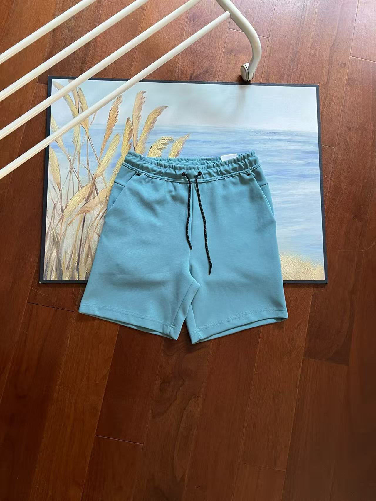 Verano nuevo estilo pequeño gancho versión en el extranjero de doce colores pantalones cortos deportivos de punto de pegamento lateral para hombres pantalones de cinco puntos 4503