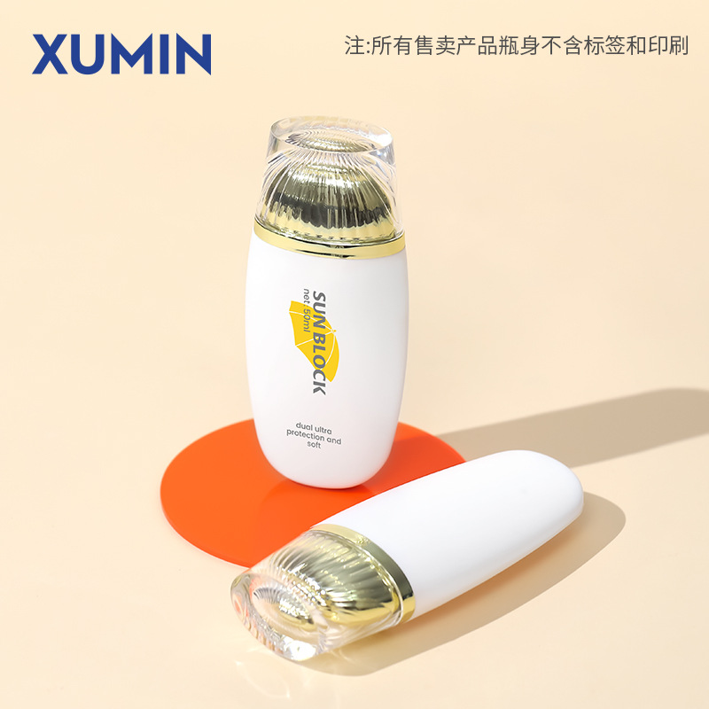 Embalaje Xumin cubierta de oro botella de protección solar PE 50g botella de manguera plana botella de crema de aislamiento blanco botella de cosméticos