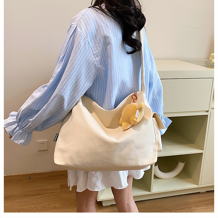 The 2024 new Korean-style simple and laid-back casual canvas crossbody bag and the large-capacity versatile tote bag are selling well details Picture
