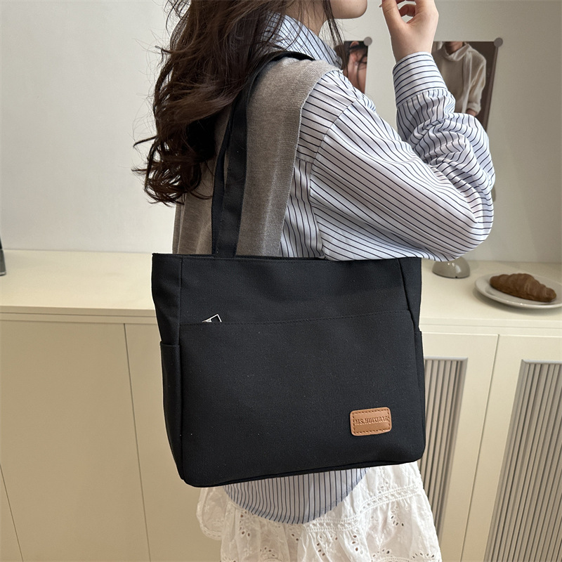 Bolsa de lona de alta capacidad para mujeres japonesas simple versátil bolso de hombro de viaje de estudiantes bolso especial