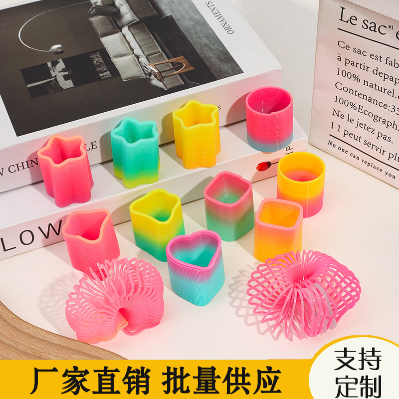 子供の魔力の虹の輪の表情の笑顔の虹のスプリングの輪の露店の弾力の積み重ねの輪の知育のノスタルジックなおもちゃ|undefined