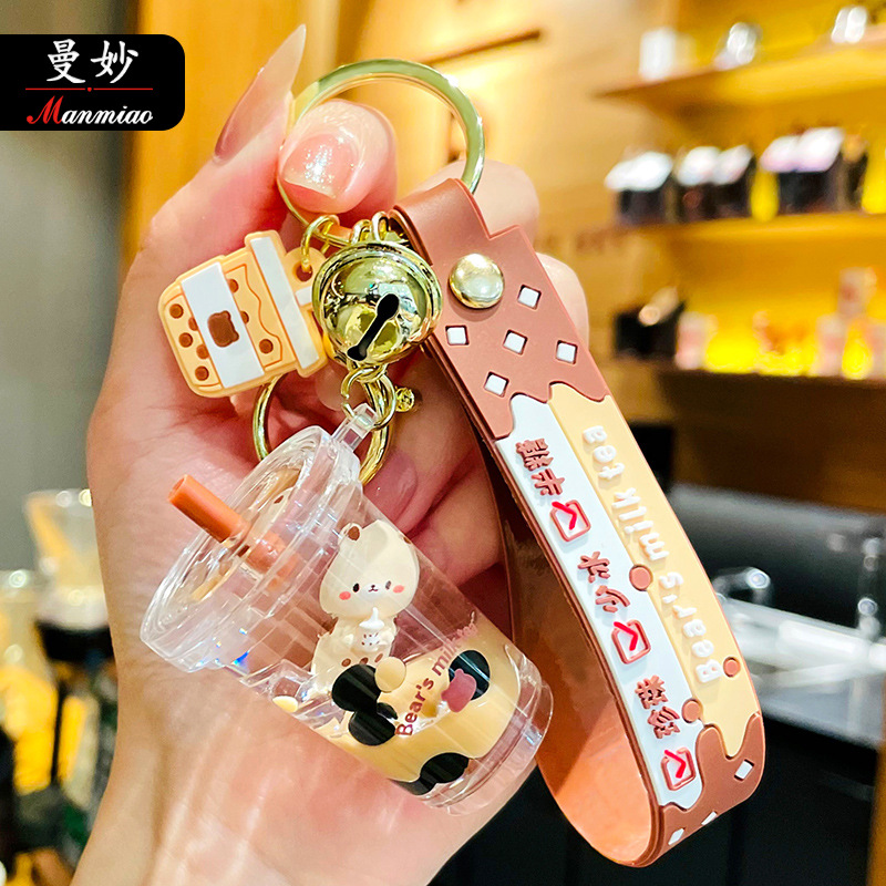 Cartoon floating pearl milk tea bear key...