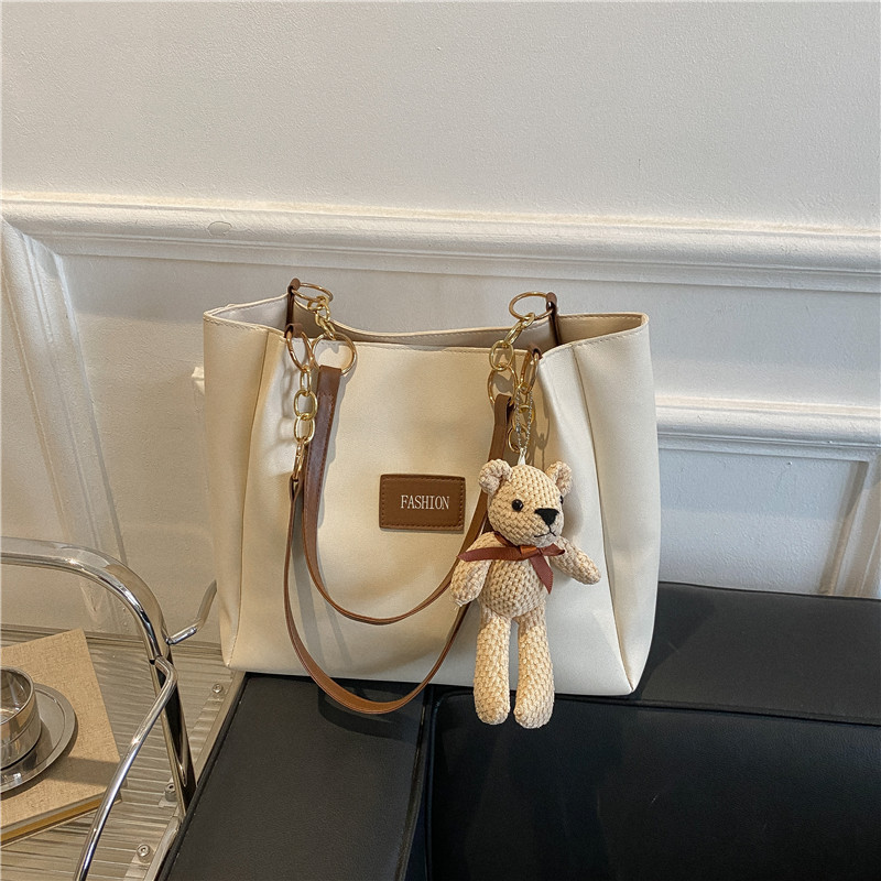 Bolsa de asas de gran capacidad de textura popular de este año para mujeres 2023 nueva moda casual estudiante bolsa de clase bolsa de cercanías