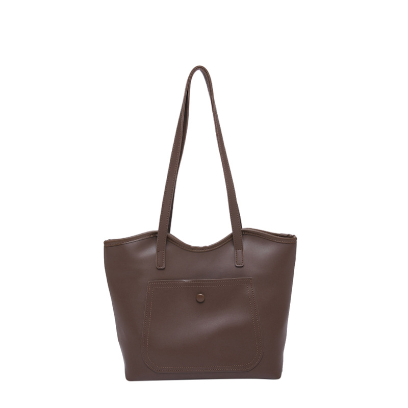 Bolso retro al por mayor para mujeres 2025 primavera nueva bolsa de hombro de gran capacidad versátil bolso de viaje portátil simple