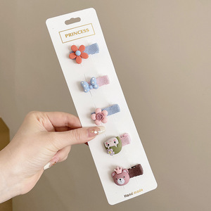Hermosos clips de cabello de color para niños coreanos de alto nivel sensación de arco de niñas bolsa de tela no daña clips de cabello de bebé