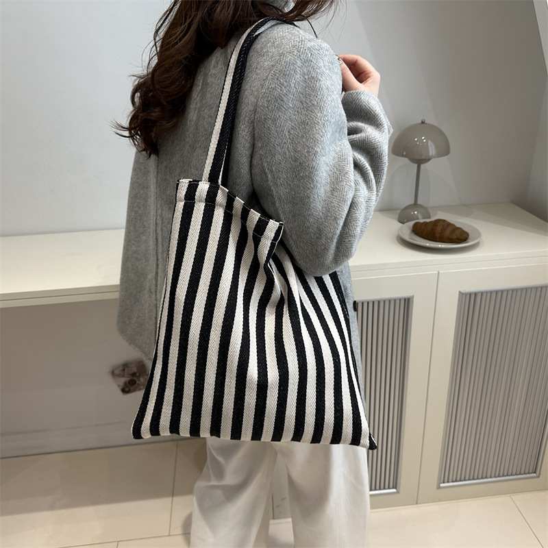 Bolsa de lona a rayas coreana simple bolso de hombro de estudiantes de literatura y arte gran capacidad de lazo bolso de mano