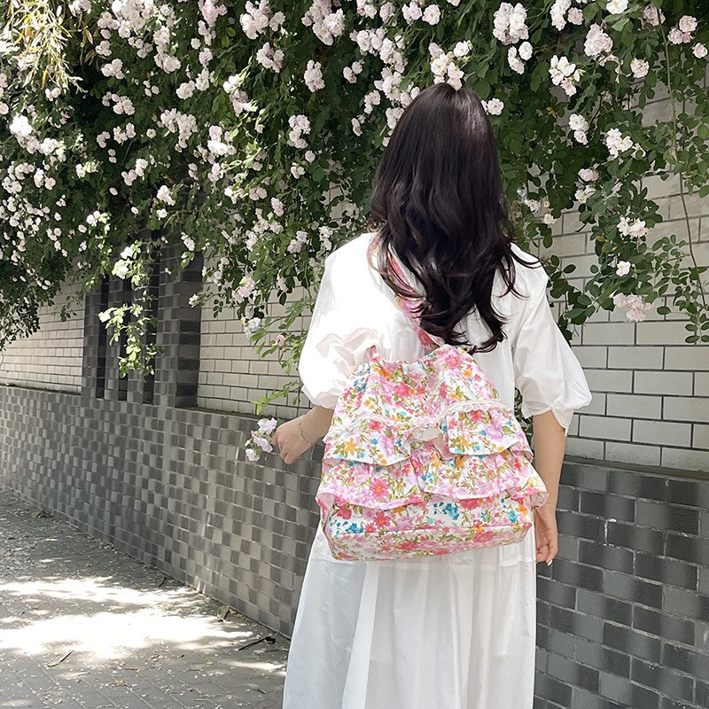 Bolsa de lona de flores coreana diaria para mujeres verano 2026 nueva moda encantadora niña brazo bolso de hombro
