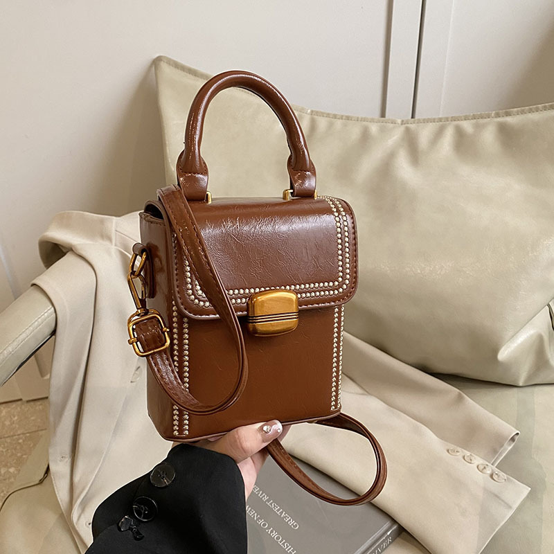 Bolso de moda retro mujer 2025 primavera nuevo bolso ocio retro bolso de nicho popular trampolín de viaje de moda