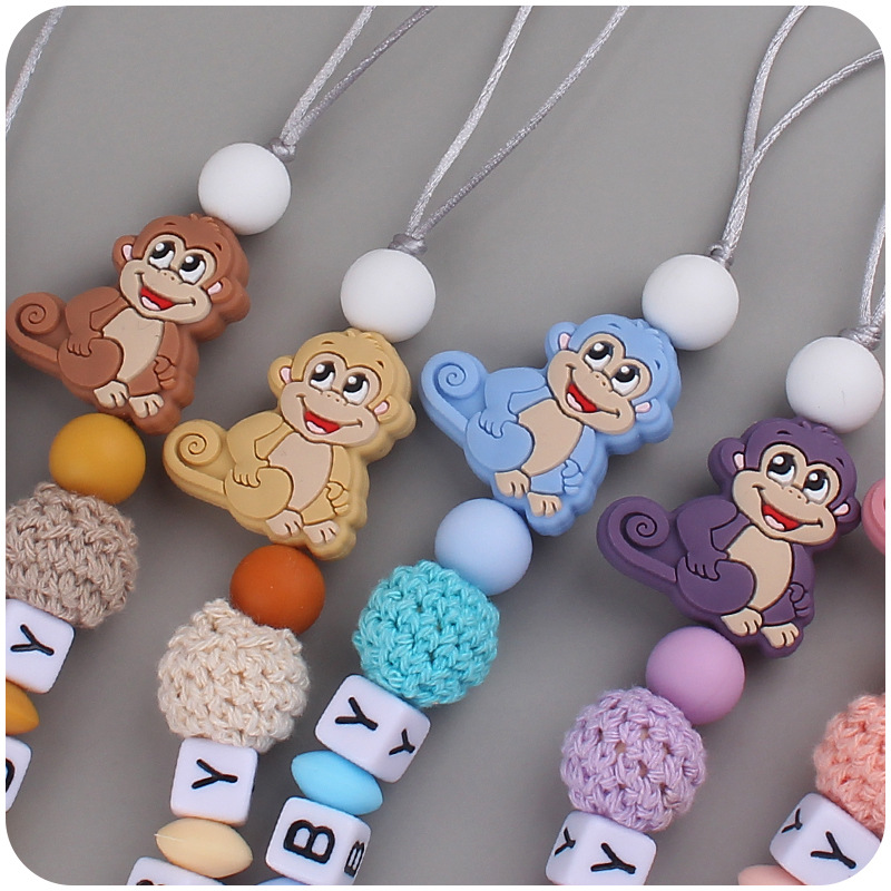 Nuevo bebé suministros de dibujos animados animal mono mordedor creativo bebé DIY mordedura molar Cadena de pezón cadena anti-caída