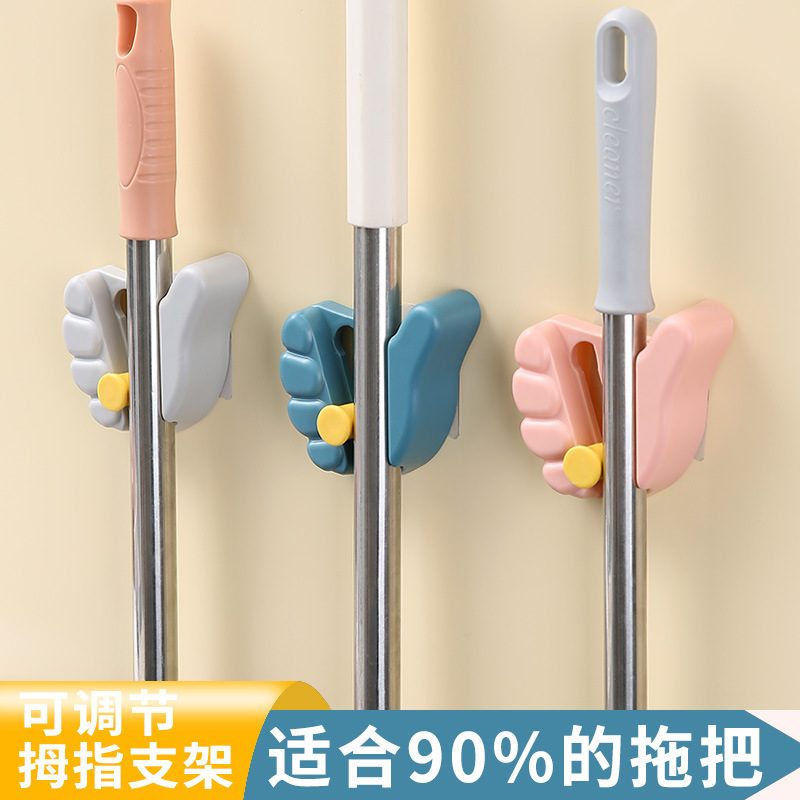 Seamless paste wall mop clip bathroom wall-mounted plastic thumb mop rack creative gesture hanger Seamless paste wall mop clip bathroom wall-mounted plastic thumb mop rack creative gesture hanger