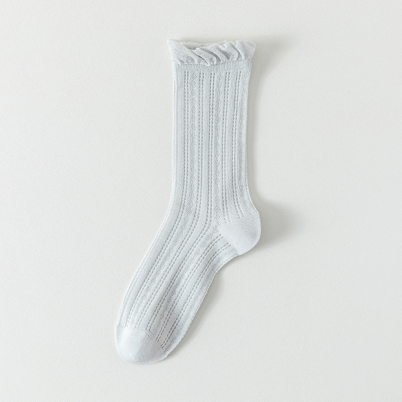 Calcetines de tubo medio Calcetines de algodón de color sólido para mujer delgada de verano Calcetines de confinamiento deshuesados Calcetines de pila de malla Calcetines de mujer Zhuji al por mayor