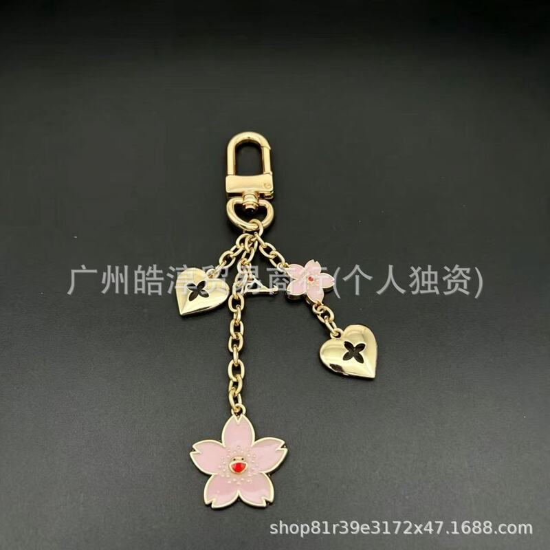 Foreign trade Murakami Takashi cherry blossom bag accessory with pink enamel cherry blossom pendant, heart pendant, cross-border keychain