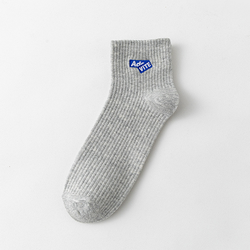 Algodón de color sólido primavera y verano unidireccional botón calcetines bordados letras rayas absorben sudor en el deporte de tendencia