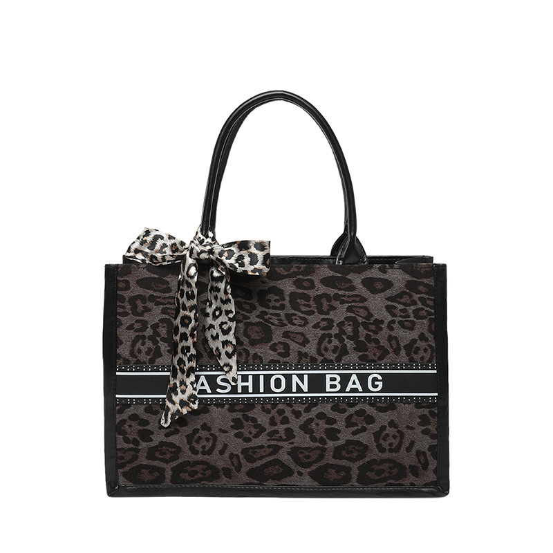 Primavera nueva moda estampado de leopardo de alta capacidad bolso de hombro de estilo extranjero bolso de viaje de nicho para mujeres